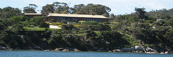 Furneaux Tavern view from the water looking up to the Tavern. The views from the Shearwater Restaurant and the Tavern bar are some of the best on the island.